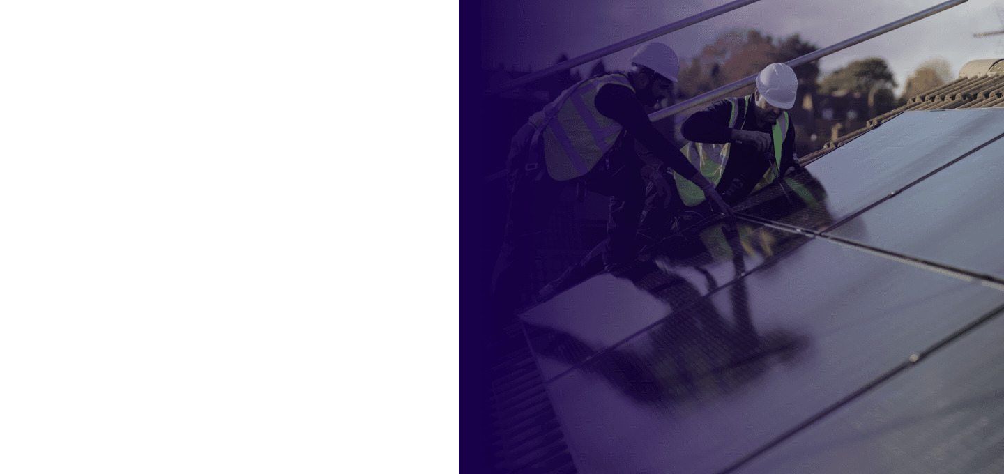 Workers on rooftop with solar panels